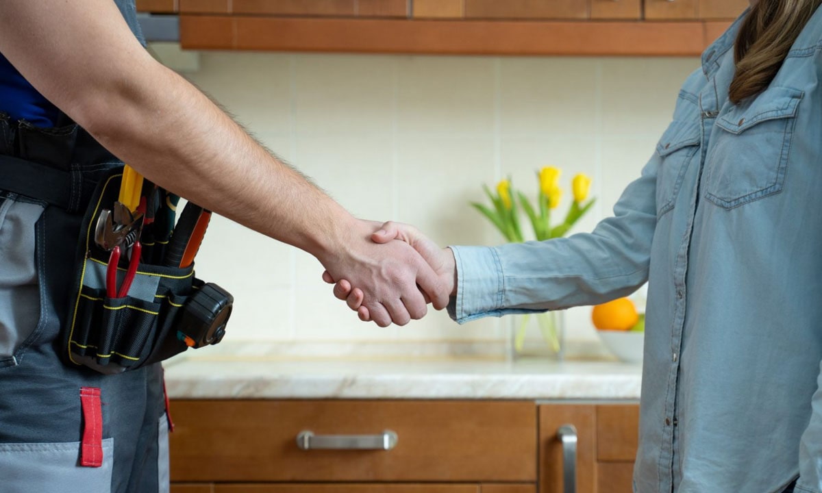 technician shaking hand customer